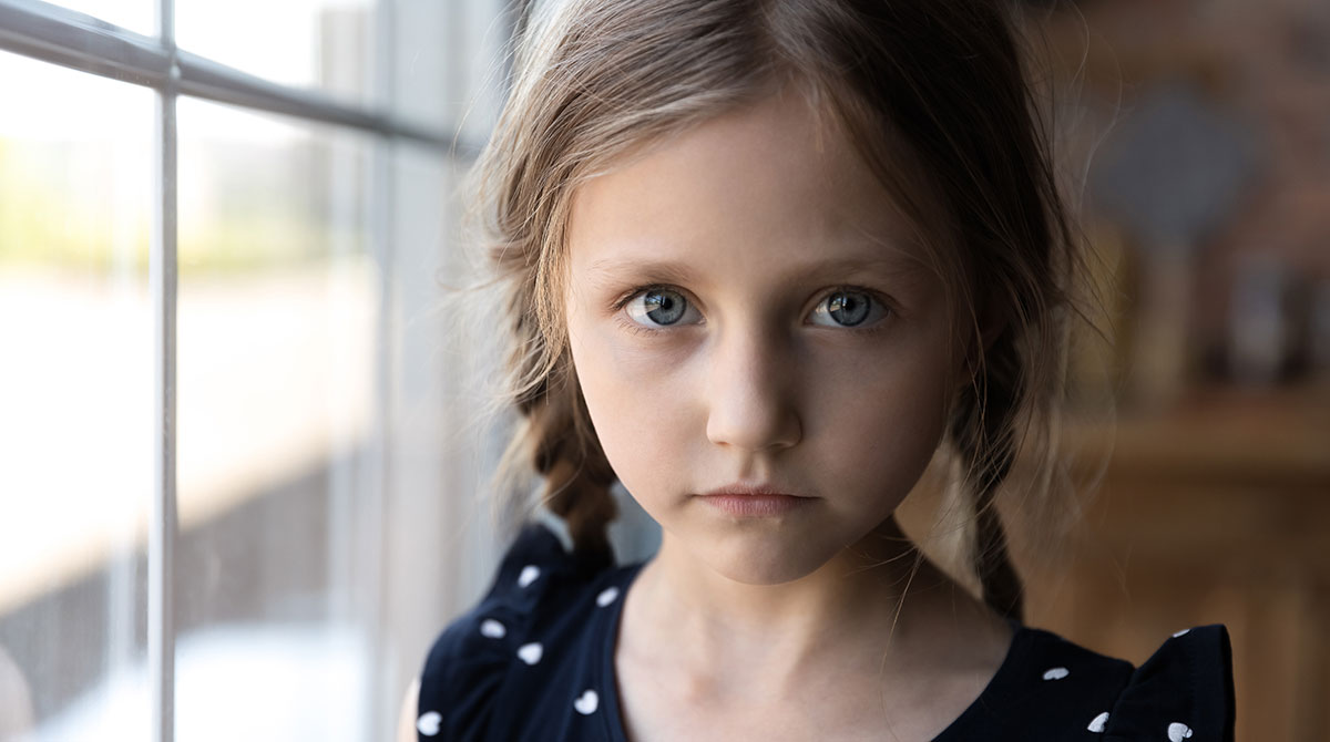 A young girl with blue eyes and braids. Learn how HR 485 reauthorizes and strengthens the Child Abuse Prevention and Treatment Act.